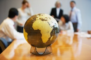Business meeting with a globe on the table